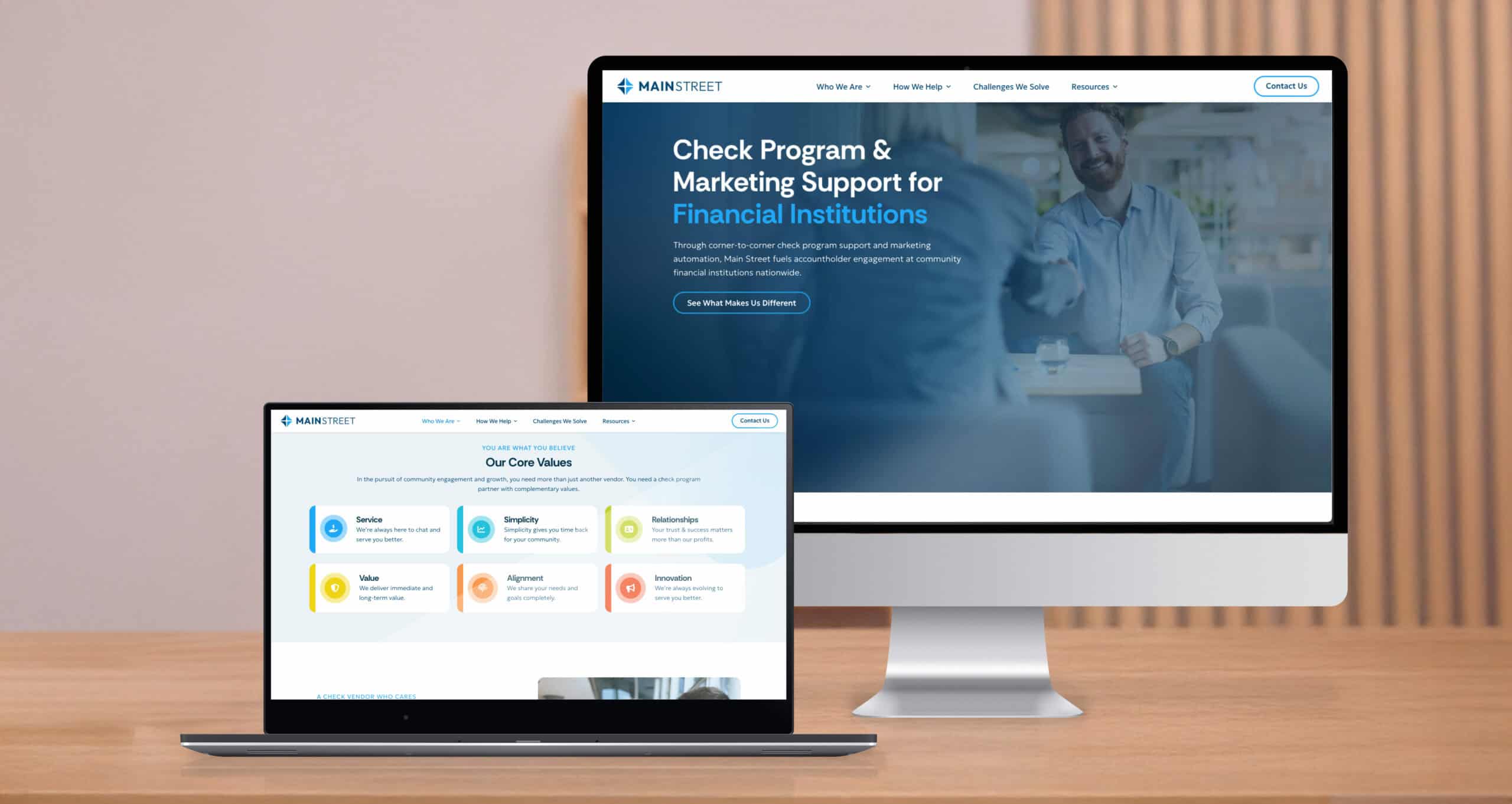 A desktop and laptop screen show different sections of the Main Street website